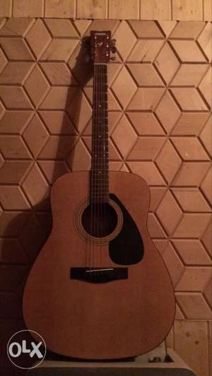 Yamaha F310 Acoustic Guitar with Bufferman Capo.