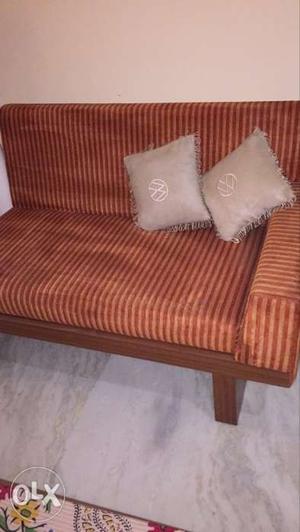 Brown Wooden Framed Red Padded Sofa in good condition at