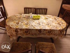 Oval Brown Floral Dinning Table With Chairs