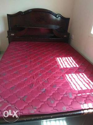 Queen size cot with cupboards along with bed. 1
