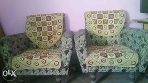 Two Brown And White Floral Sofa Chairs