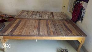Two Brown Wooden Bed Frames
