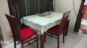 Wooden 4 seater Dining Table Set with two chairs for Rs 