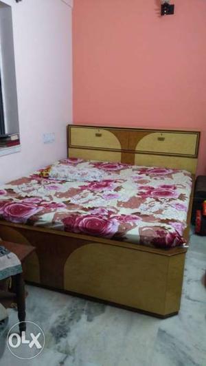 6 by 7 king size wooden bed with mattress.