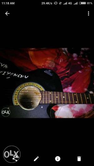 Black And Brown Cutaway Acoustic Guitar Screenshot