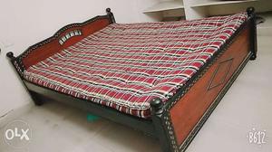 Brand new queen size bed with mattress.