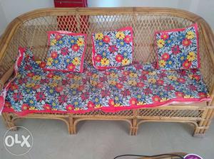 Cane sofa with tea stand