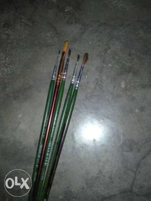 Green And Red Paint Brushes