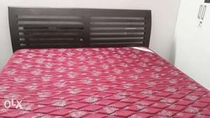 King size cot with Kurlon mattress. The cot has