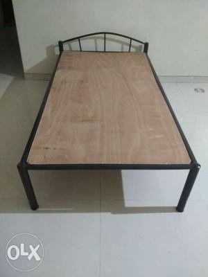 Rectangular Black Metal Framed Brown Wooden Coffee Table