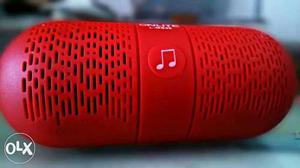 Red color Bluetooth speaker good condition onlite company