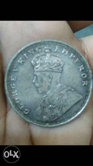 Round Silver-colored Coin