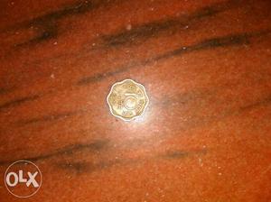  Scalloped Bronze-colored 10 Indian Paise Coin