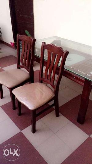 Six Brown Wooden Framed Padded Chairs with dining table