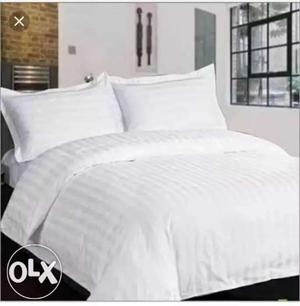 Size  white bed sheet with two pillow cover.