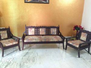Two Black Wooden Framed Brown Padded Sofa Chairs