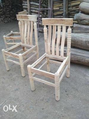 Two Brown Wooden Rocking Chairs