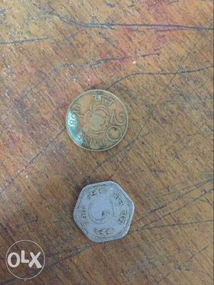 Two Silver-colored And Gold-colored Indian Coins