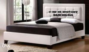 White Leather Bed With And Black Mattress