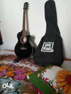 Black Cutaway Acoustic Guitar With Black Gig Ba