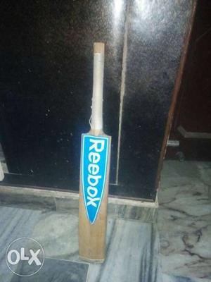 Brown, Blue, And White Reebok Cricket Bat