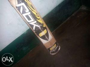 Brown, White, And Black Reebok Cricket Bat