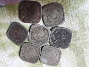 Five Silver-colored And Two Copper-colored Coins