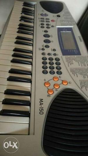 Gray Casio MA-150 Electronic Keyboard
