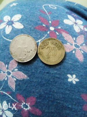 Old 25 paise Indian coin.one is  and another
