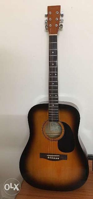 One year old, never used Granada acoustic guitar