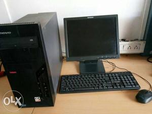 Black Computer Monitor, Keyboard, Mouse And Tower