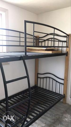 Wood and iron bunker bed with mattress