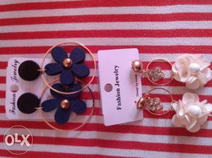 Wooden earrings and white flower earrings at such