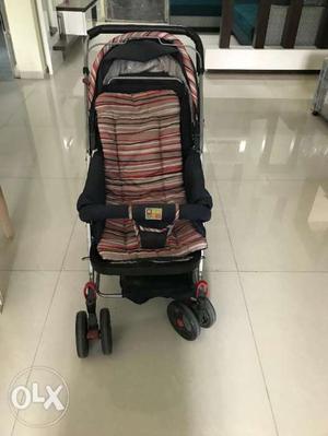 A gently used baby stroller of Mee Mee brand for sale.