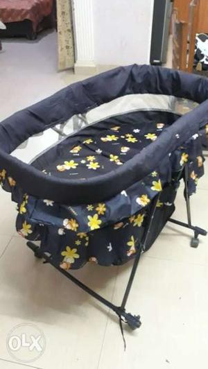 Movable cot with additional basket given below