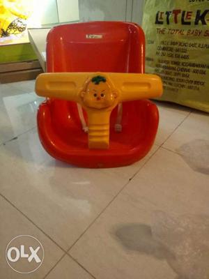 Red And White Plastic Feeding Chair