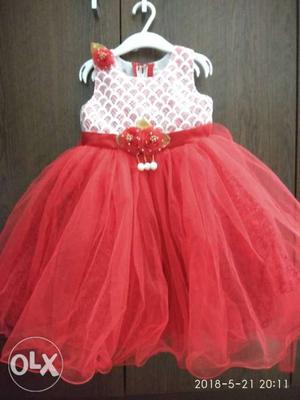 Red and white frock can be fitted to 1yr to 1.5yr