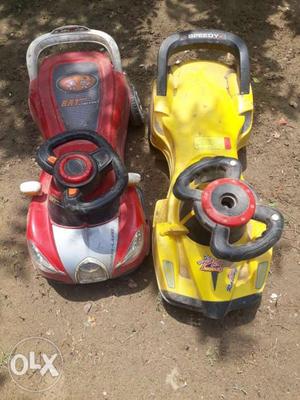 Toddler's Two Red And Yellow Ride-on Toys