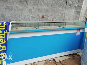 Display Case With White And Blue Wooden Frame