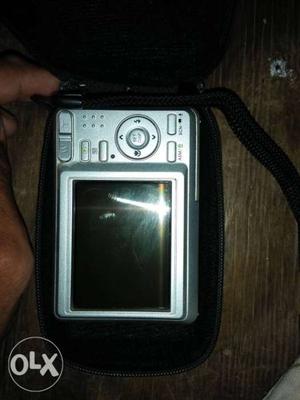Grey Point-and-shoot Camera With Bag