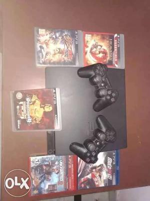 Ps3 with 5 cds nd two controllers good condition