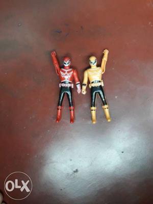 Two Red And Yellow Power Rangers Action Figures