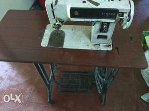 White Steel Sewing Machine With Brown Wooden Table (fashion