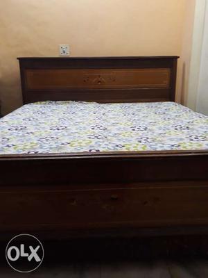 A double bed ( inches)with 2 boxes for