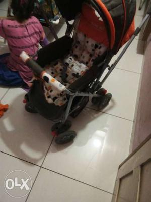 Baby's White And Red Floral Stroller