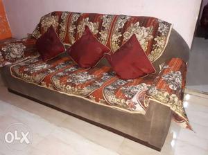 Brown And White Floral Fabric Sofa With Throw Pillows