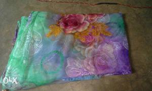 Green, Purple, And Pink Floral Textile