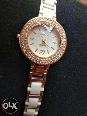 Ladies hand watch white and golden colour one