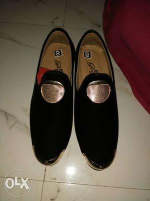 Pair Of Black Suede Loafers