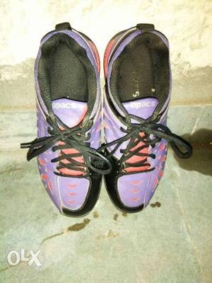 Pair of shoes of spaces company of purple colour